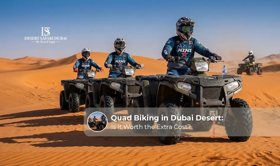 Tourists riding quad bikes across the Dubai desert sand dunes